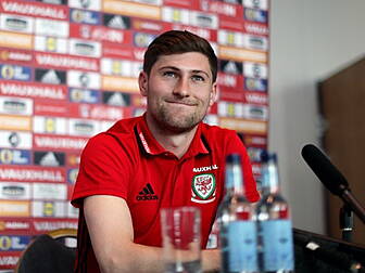 Wales' Ben Davies comforta...